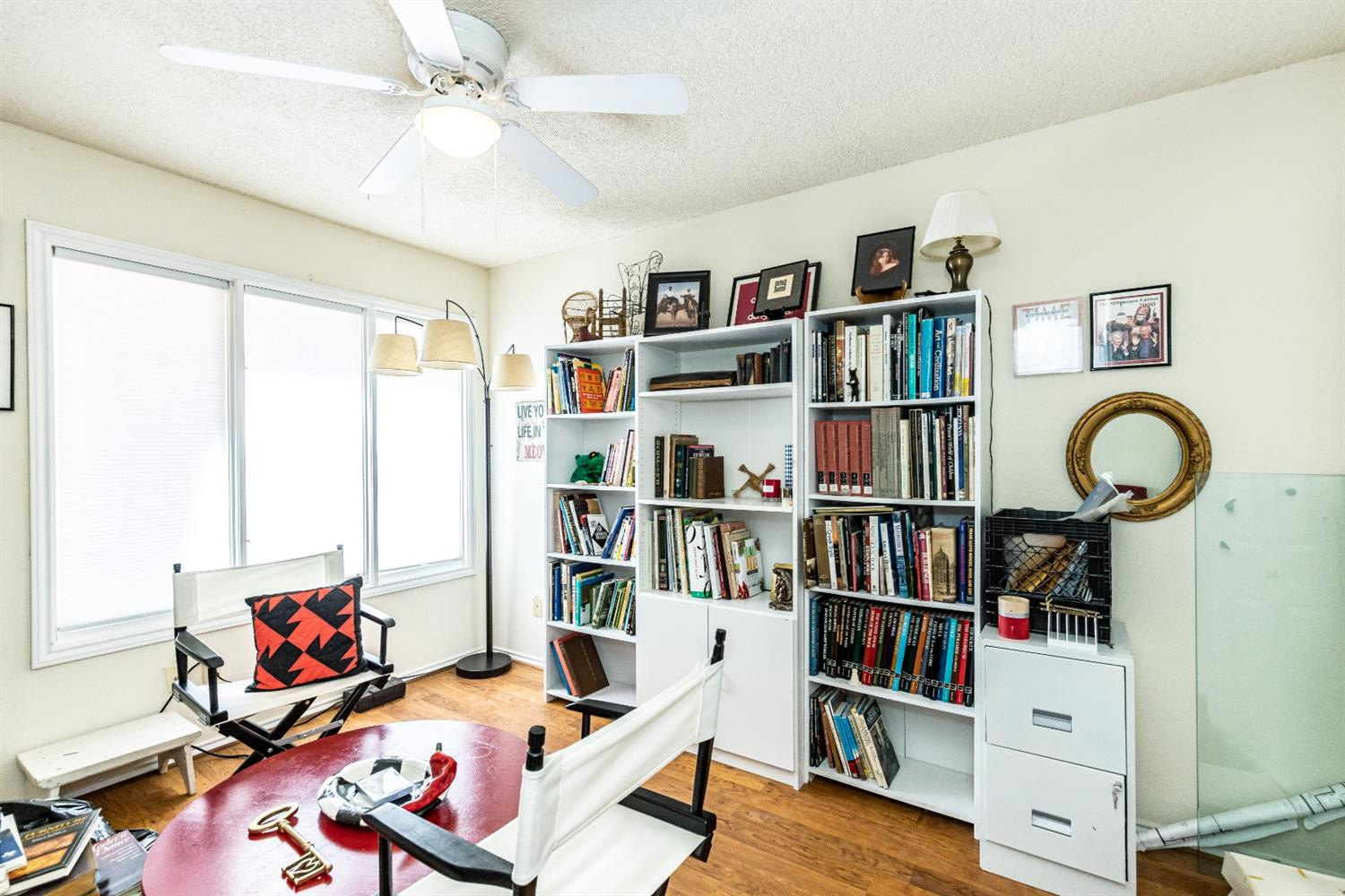 5221 84th Street Lubbock, TX 79424 - Photo 33 of 42 a room with furniture and a book shelf