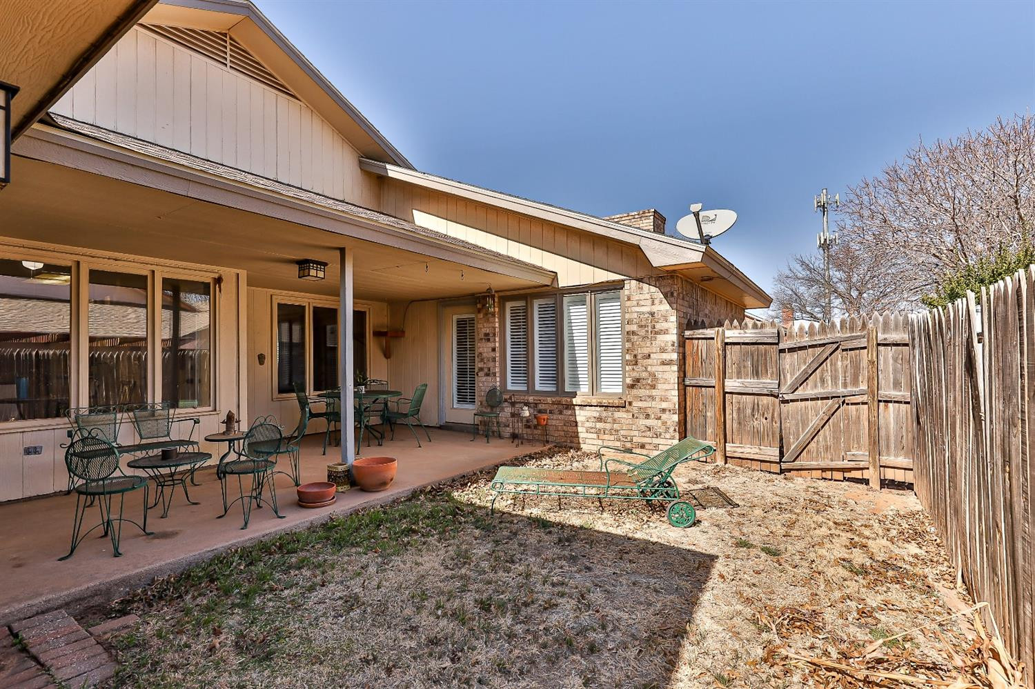 5221 84th Street Lubbock, TX 79424 - Photo 39 of 42 a view of a house with backyard porch and sitting area