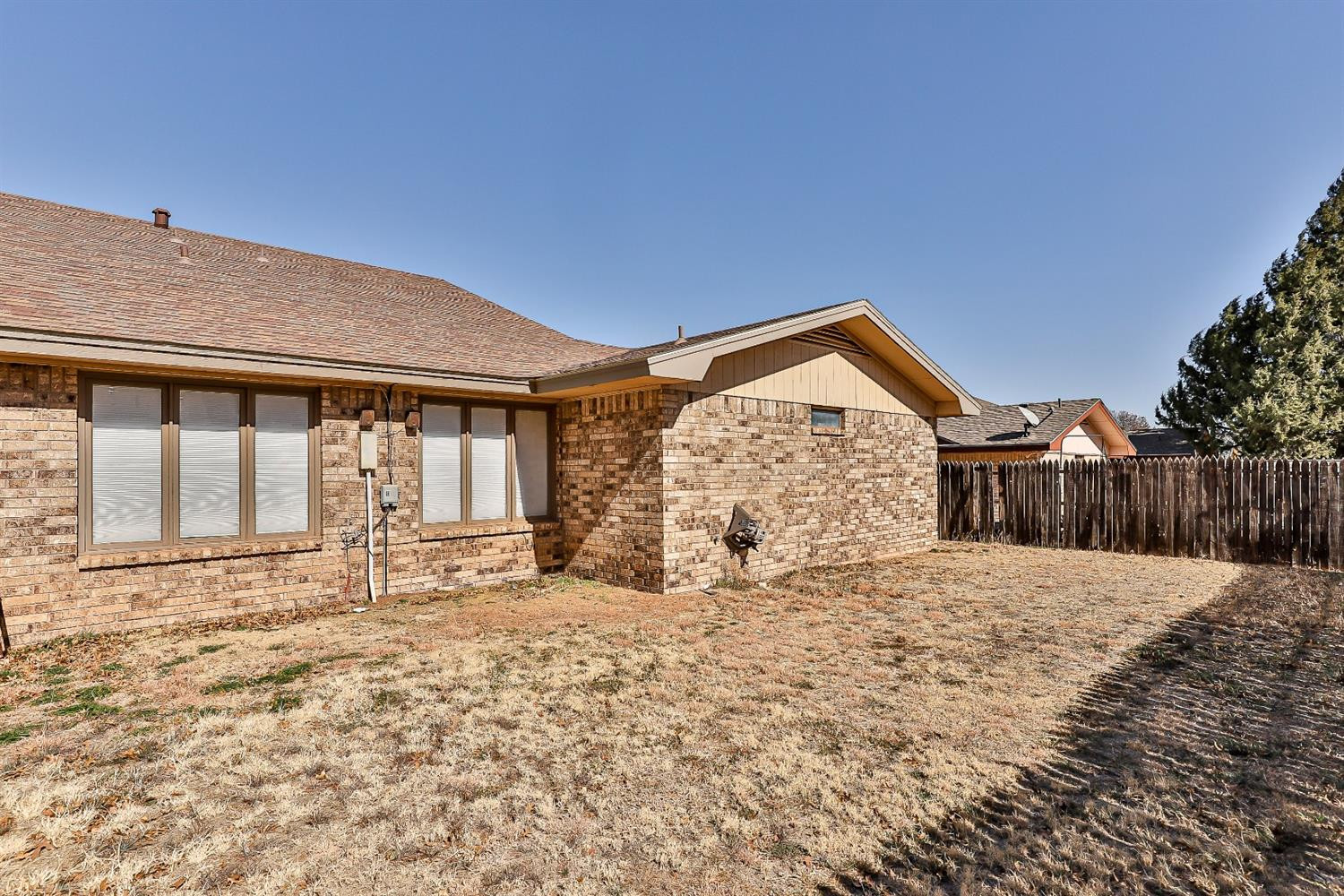 5221 84th Street Lubbock, TX 79424 - Photo 41 of 42 a front view of a house with a yard