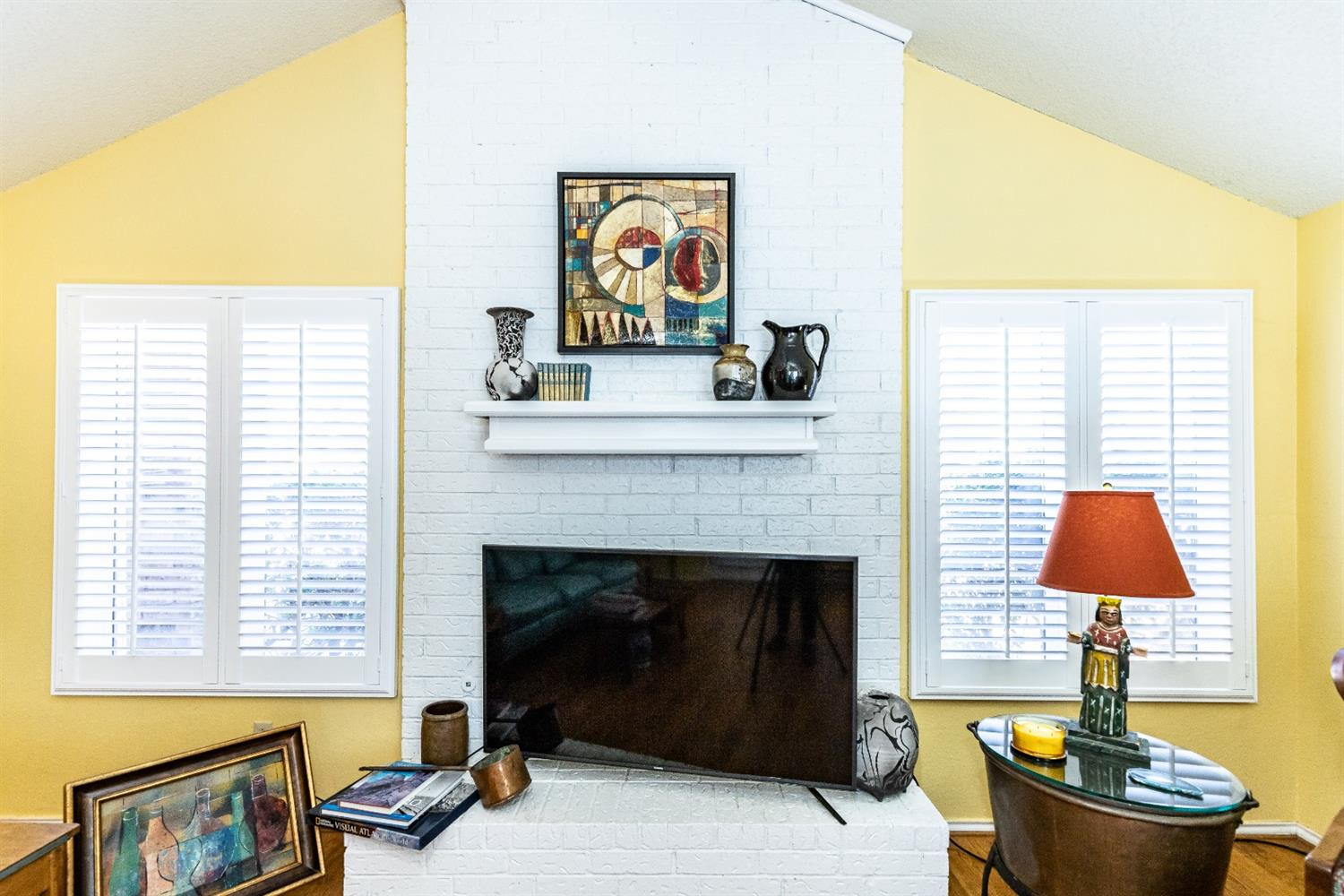 5221 84th Street Lubbock, TX 79424 - Photo 7 of 42 a living room with furniture and a fireplace