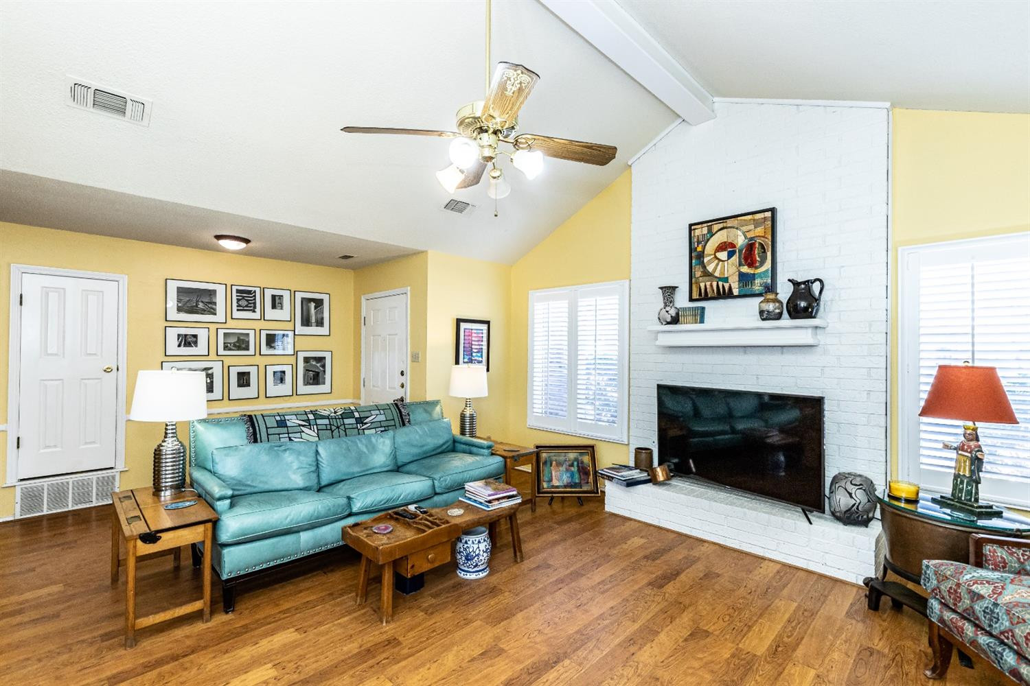 5221 84th Street Lubbock, TX 79424 - Photo 8 of 42 a living room with furniture and a fireplace
