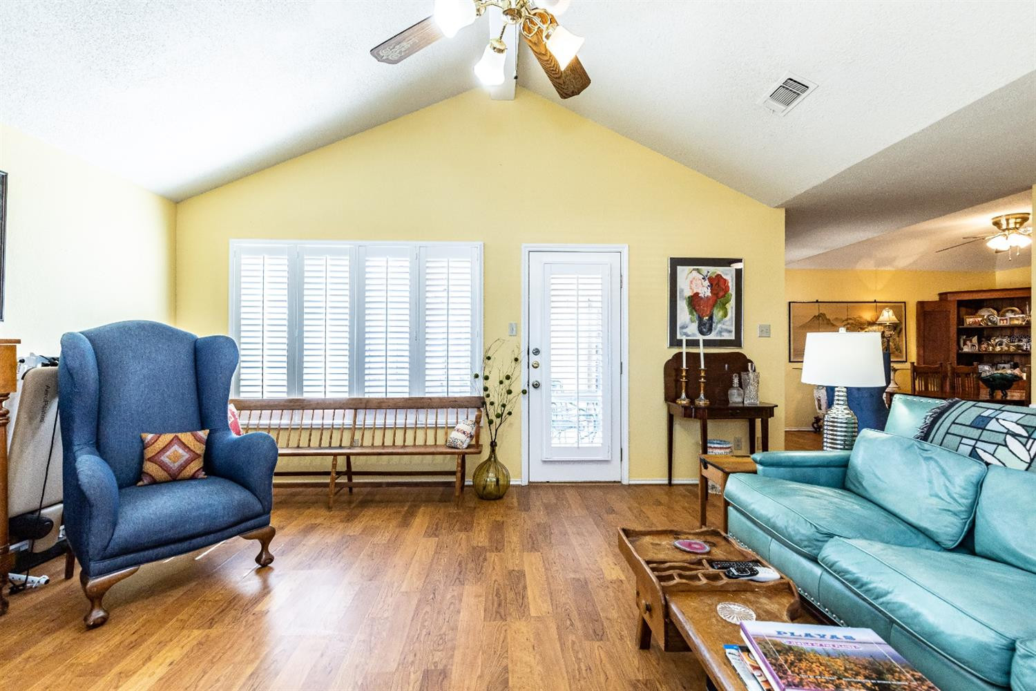 5221 84th Street Lubbock, TX 79424 - Photo 10 of 42 a living room with furniture and a wooden floor
