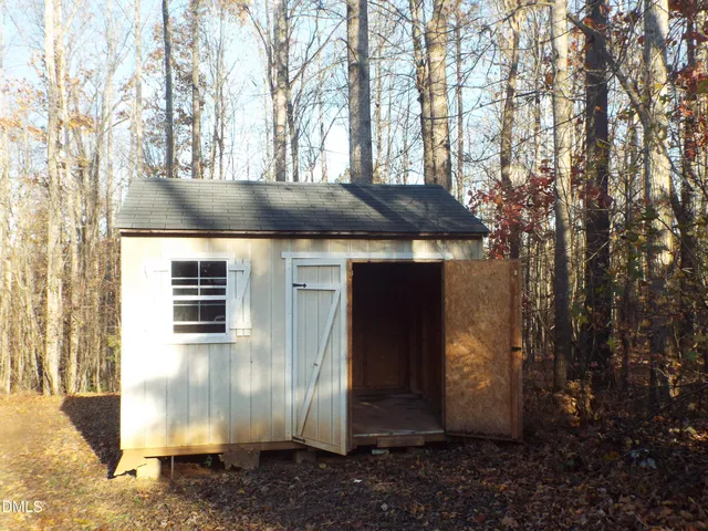a view of empty room with floor to ceiling window