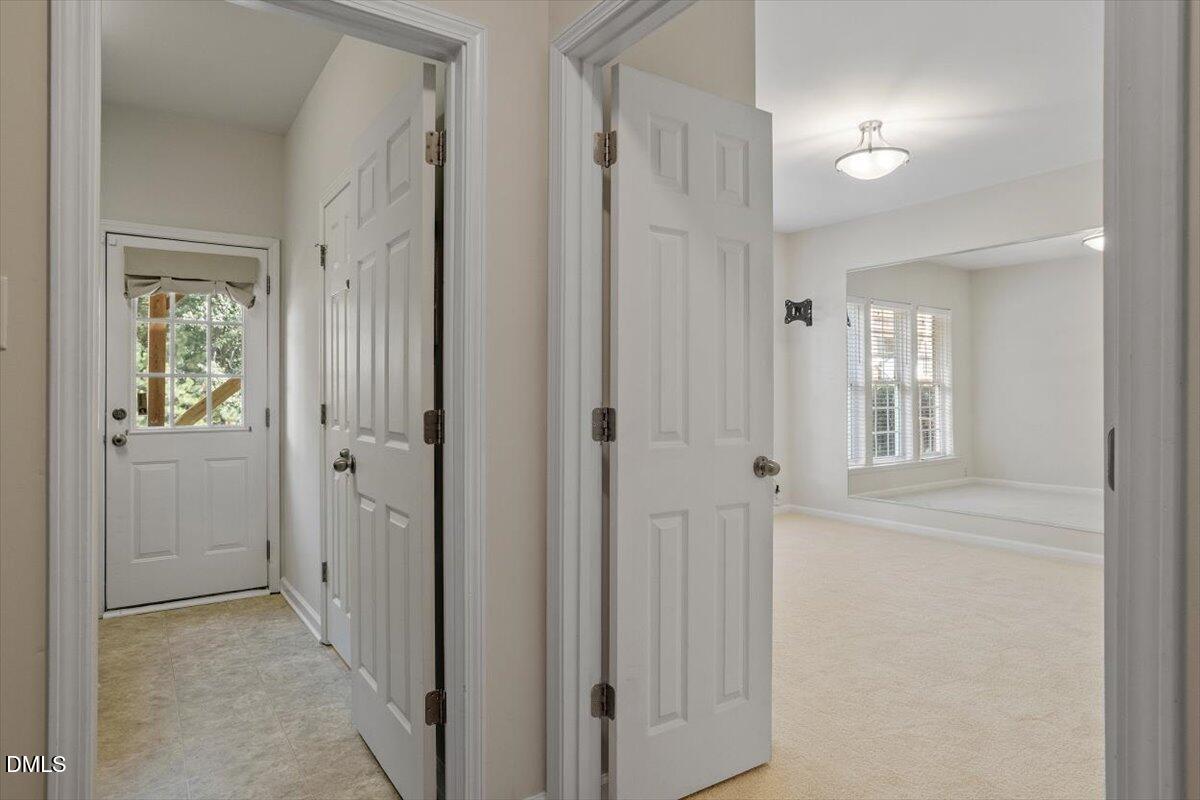 2746 Laurel Cherry Street Raleigh, NC 27612 - Photo 12 of 23 a view of a hallway with wooden floor