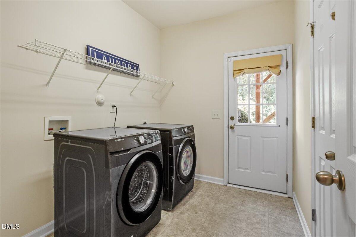 2746 Laurel Cherry Street Raleigh, NC 27612 - Photo 13 of 23 a utility room with dryer and washer