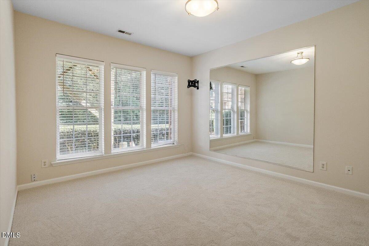 2746 Laurel Cherry Street Raleigh, NC 27612 - Photo 14 of 23 a view of an empty room with a window