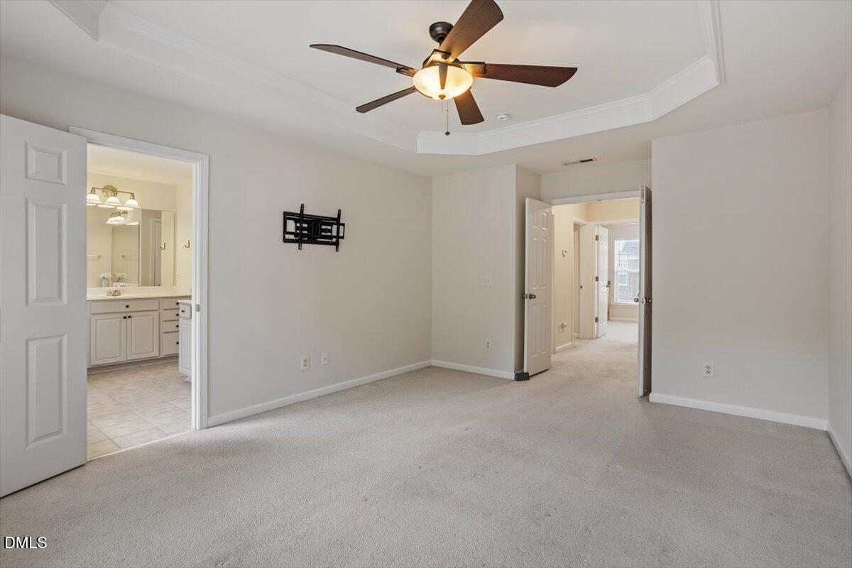 2746 Laurel Cherry Street Raleigh, NC 27612 - Photo 17 of 23 an empty room and chandelier fan