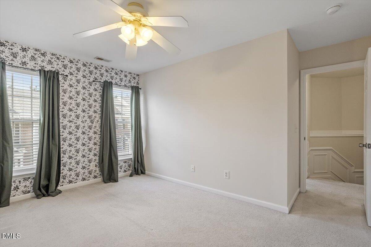 2746 Laurel Cherry Street Raleigh, NC 27612 - Photo 21 of 23 wooden floor in an empty room with a window