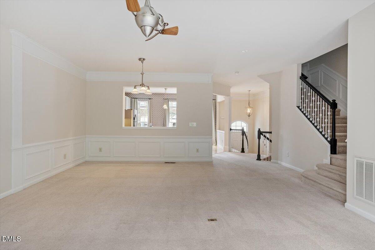 2746 Laurel Cherry Street Raleigh, NC 27612 - Photo 10 of 23 a view of a livingroom with a staircase