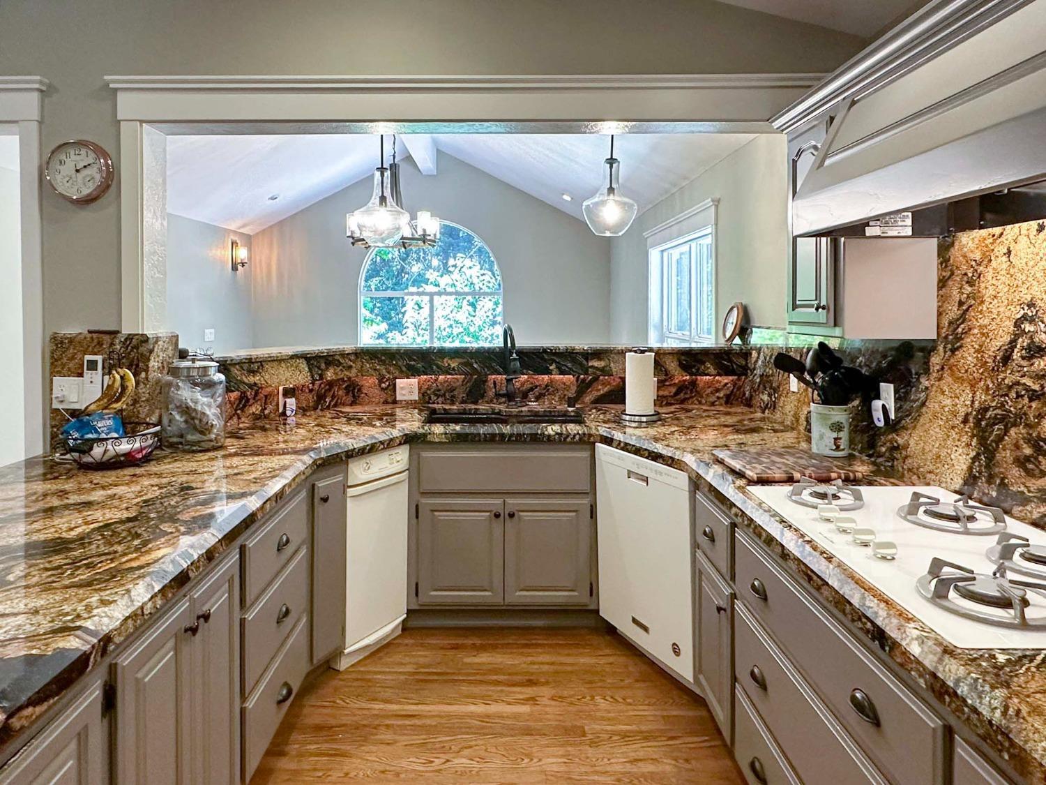 16878 Pasquale Road Nevada City, CA 95959 - Photo 8 of 36 a kitchen with a sink stove and cabinets