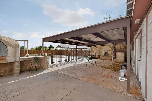 a view of a backyard with sitting area
