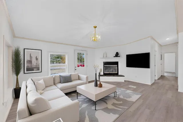 a living room with furniture and a flat screen tv