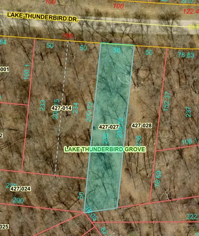 a sign on the wall next to a road