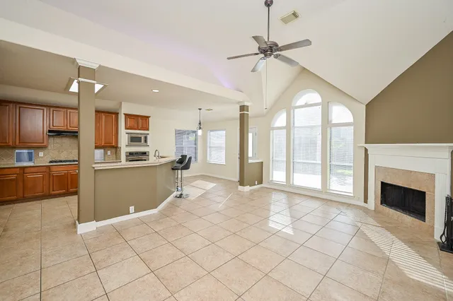 a view of a kitchen with furniture and a fireplace