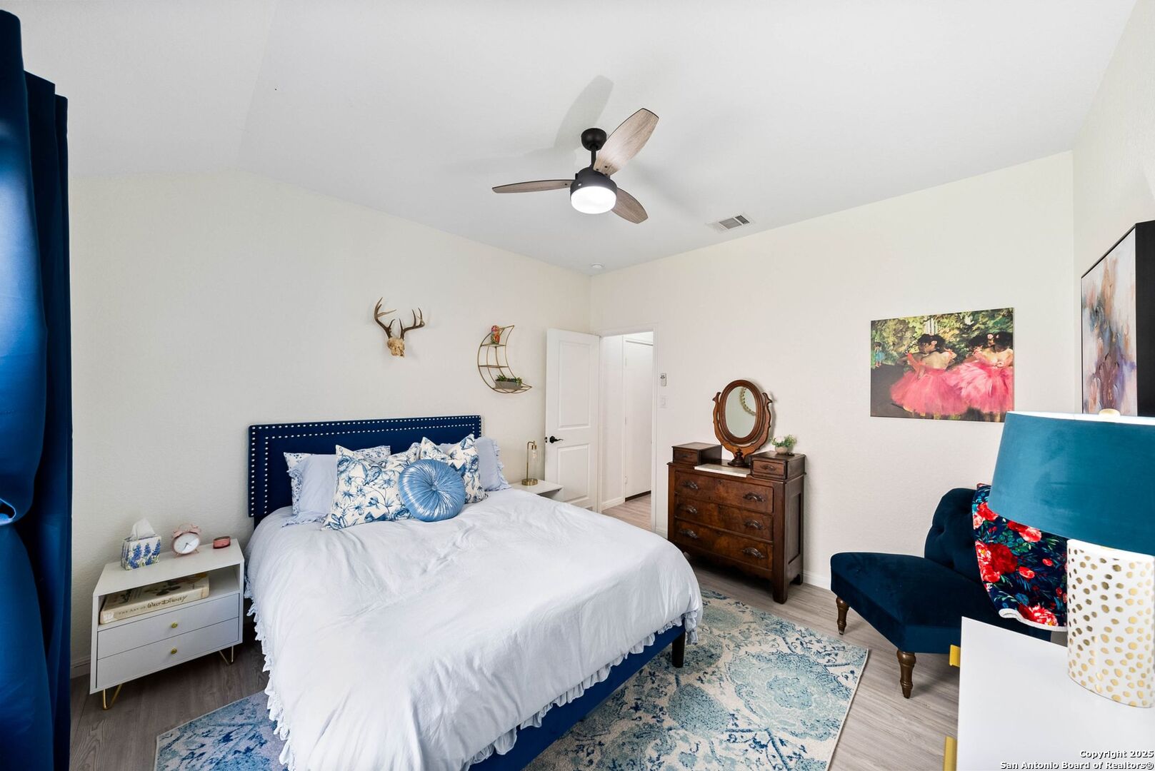 5483 Jasmine Bulverde, TX 78163 - Photo 23 of 71 a bedroom with a bed and a chandelier