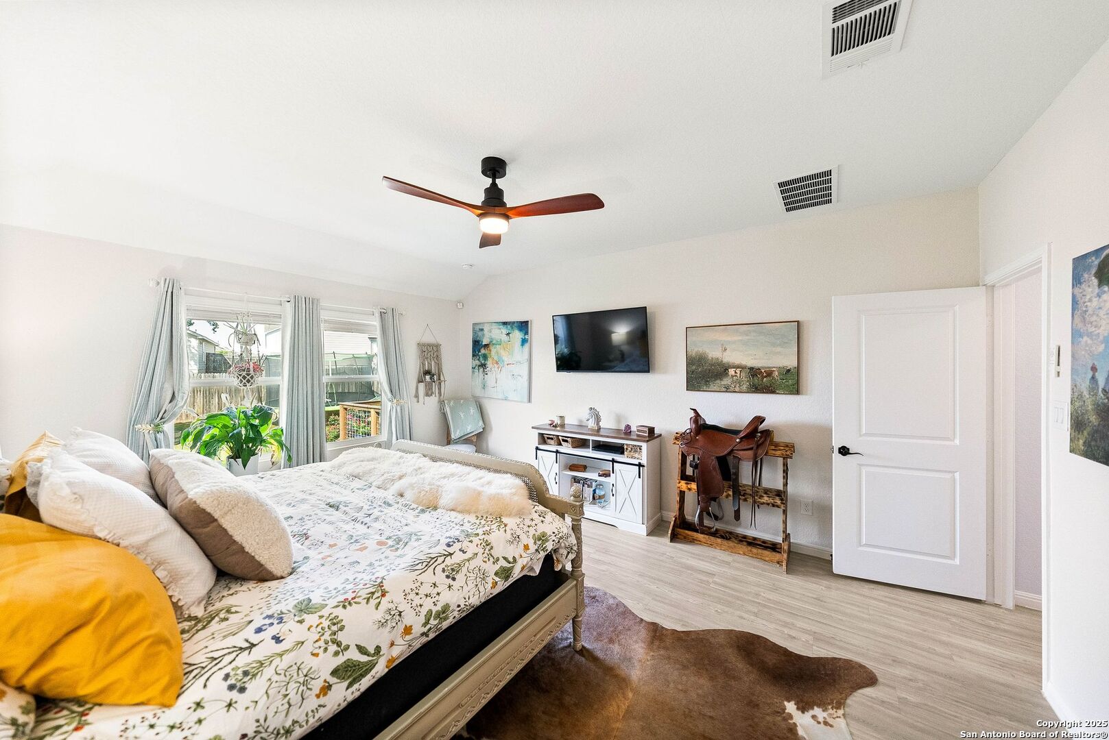 5483 Jasmine Bulverde, TX 78163 - Photo 26 of 71 a spacious bedroom with a bed and a flat screen tv