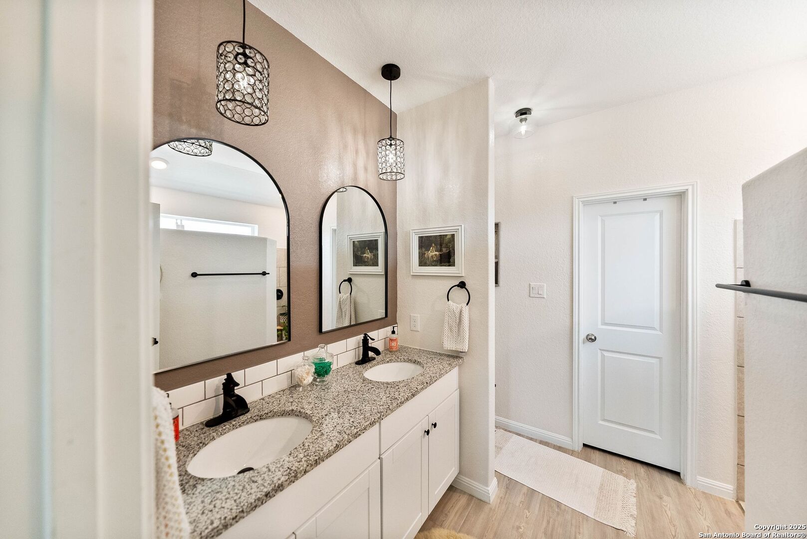 5483 Jasmine Bulverde, TX 78163 - Photo 28 of 71 a en suite bathroom with a granite countertop double vanity sink and a mirror