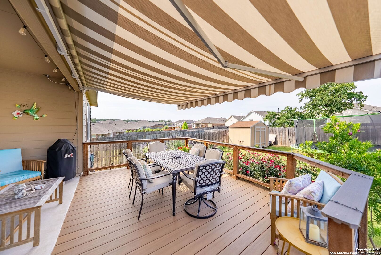 5483 Jasmine Bulverde, TX 78163 - Photo 33 of 71 a patio with wooden floor a barbeque oven and outdoor seating