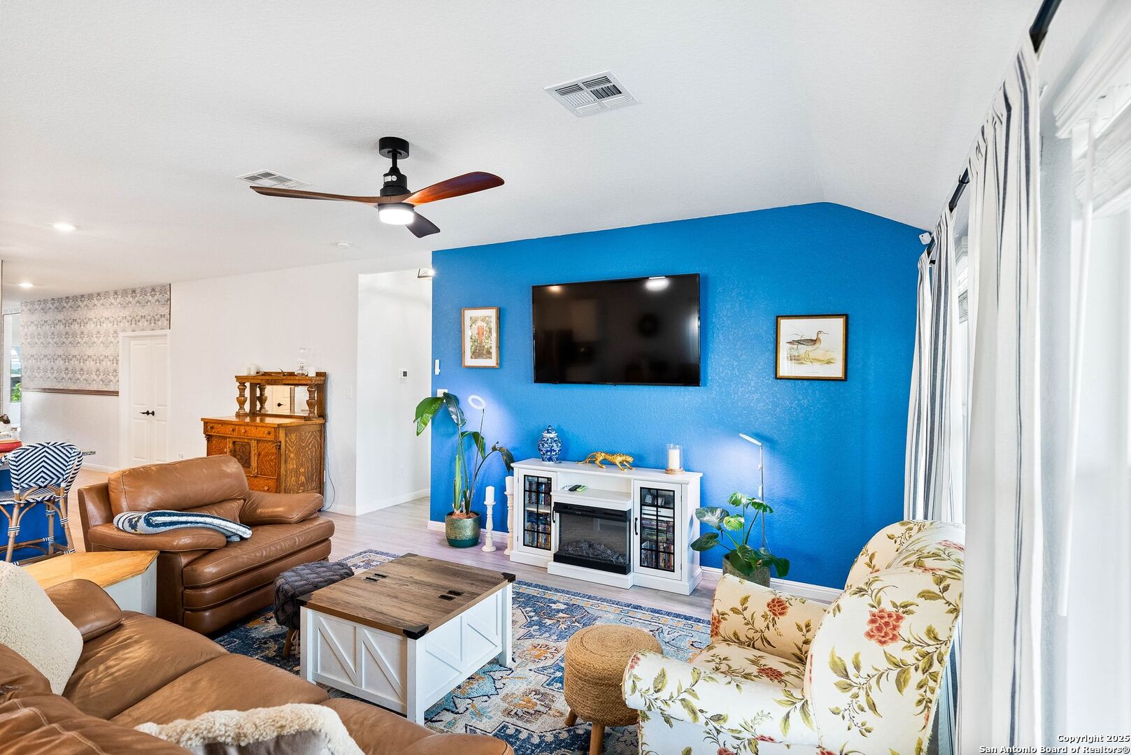 5483 Jasmine Bulverde, TX 78163 - Photo 5 of 71 a living room with furniture a flat screen tv and kitchen view