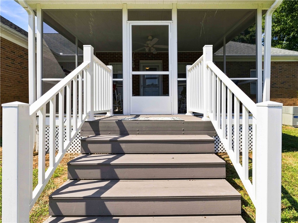 2861 Fairview Road Simpsonville, SC 29680 - Photo 25 of 42 Sturdy steps lead directly up to a comfortable screened back porch with clean white railings.