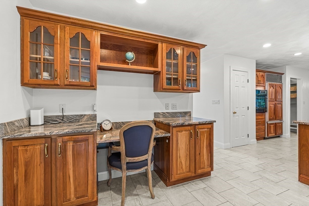 276 High Street Winchester, MA 01890 - Photo 15 of 38 a kitchen that has a stove and chair