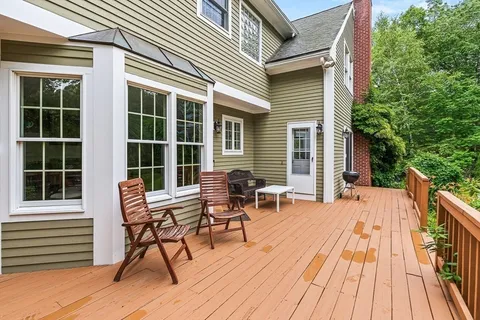 a outdoor view with a sitting space and large windows