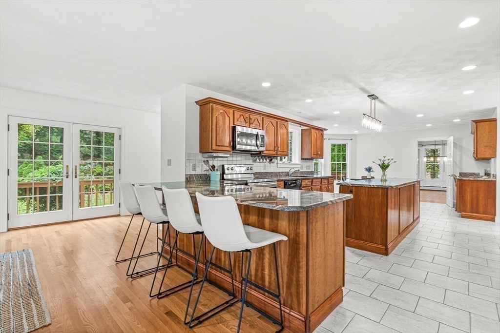 276 High Street Winchester, MA 01890 - Photo 10 of 38 a view of a dining room with furniture and wooden floor