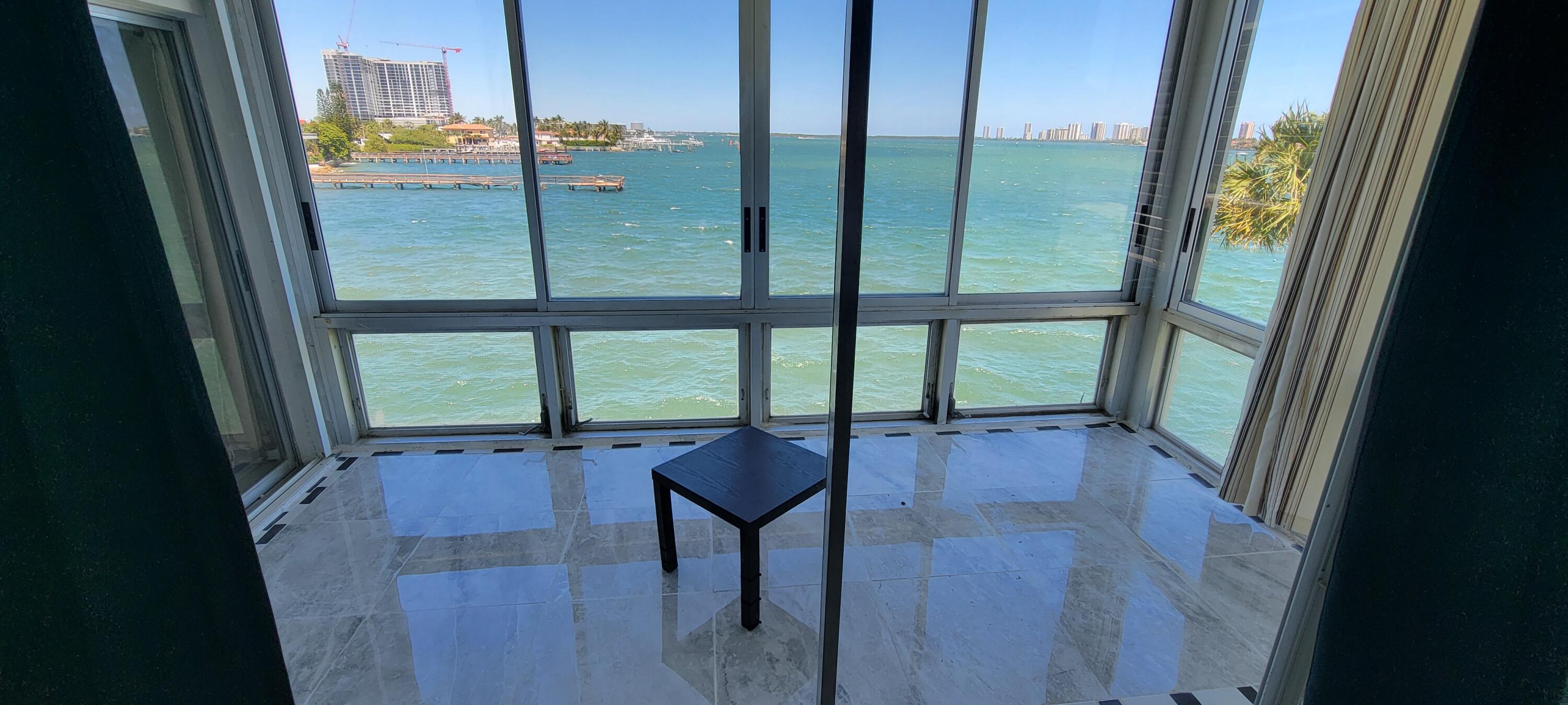 410 Wilma Circle, Unit 308 Riviera Beach, FL 33404 - Photo 24 of 27 a view of empty room with furniture and window