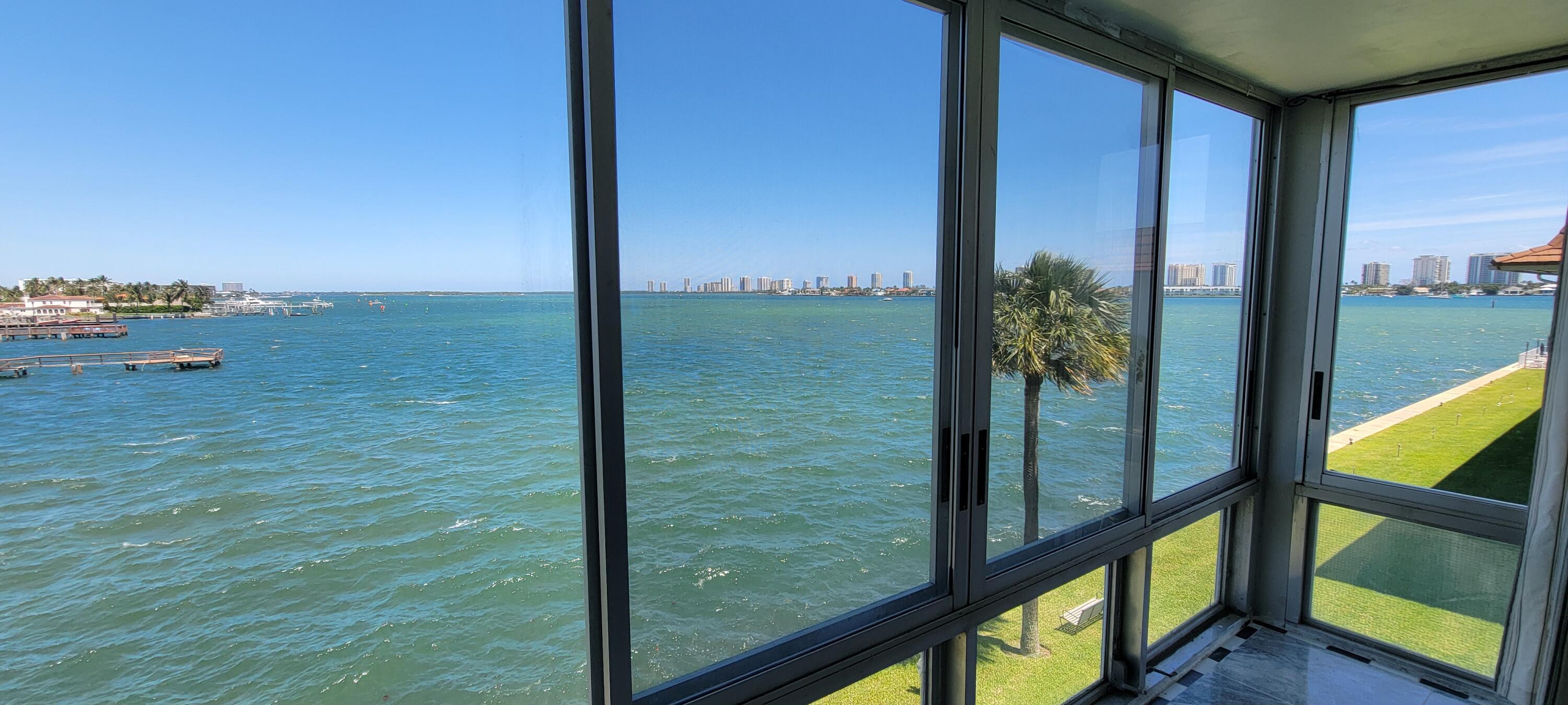 410 Wilma Circle, Unit 308 Riviera Beach, FL 33404 - Photo 25 of 27 a view of a glass door and porch