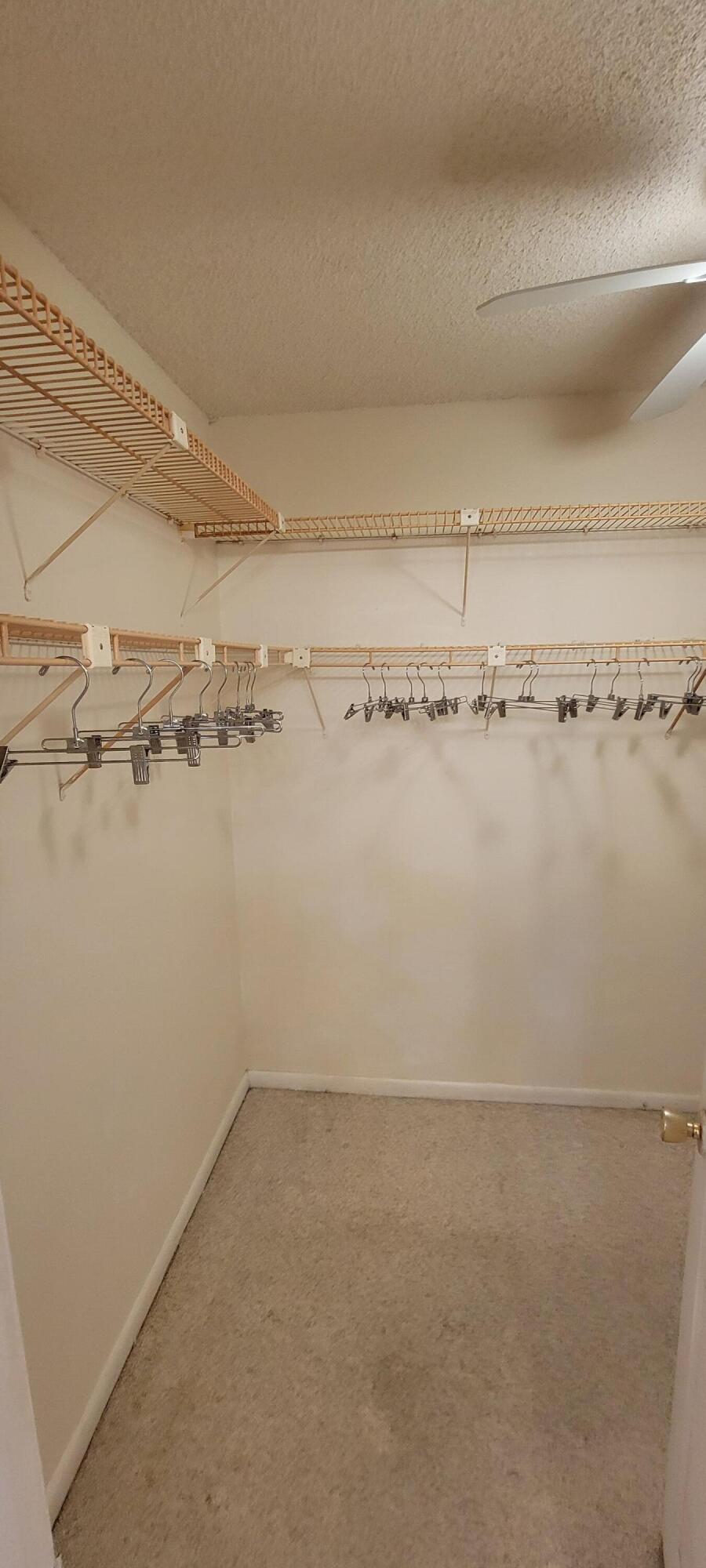 410 Wilma Circle, Unit 308 Riviera Beach, FL 33404 - Photo 7 of 27 a view of a room with racks on the wall