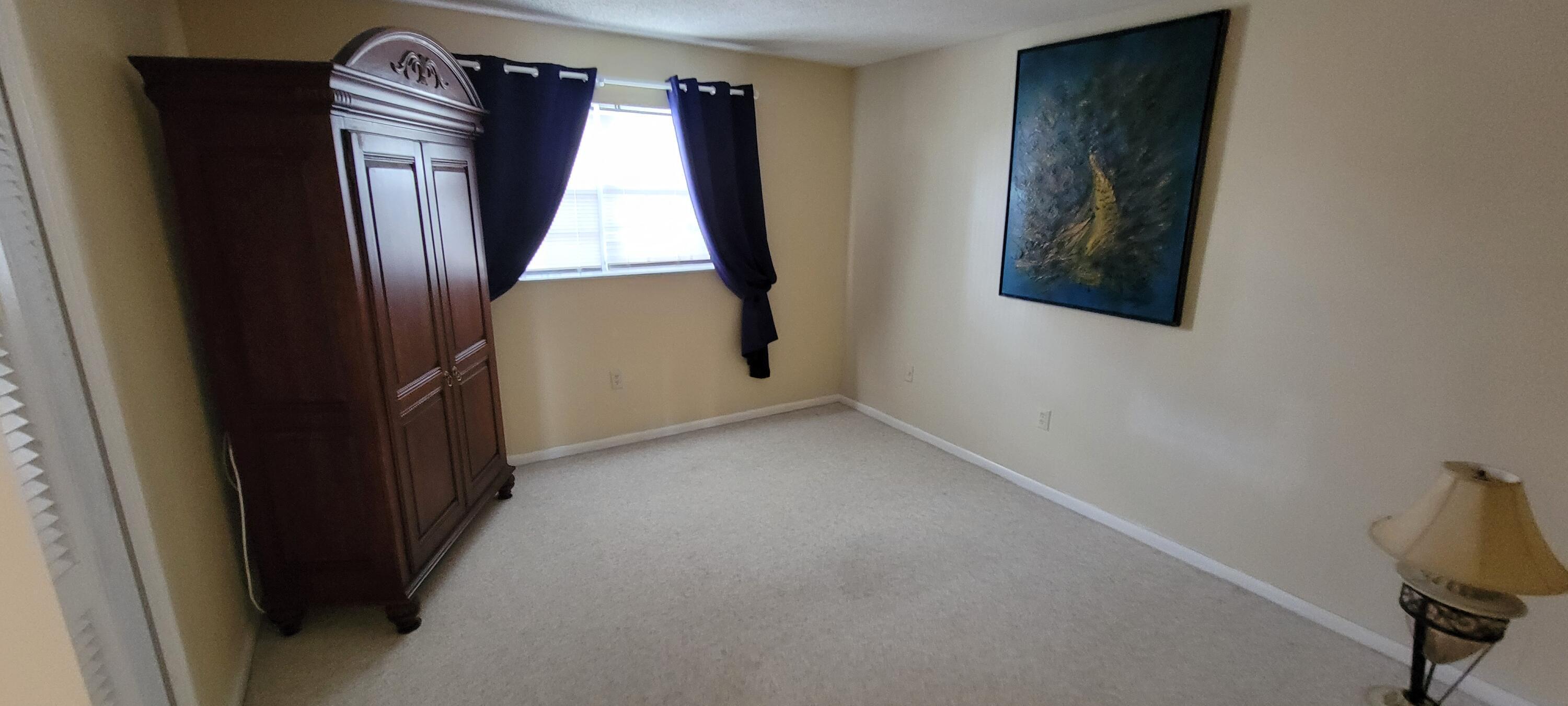 410 Wilma Circle, Unit 308 Riviera Beach, FL 33404 - Photo 9 of 27 a view of front door with wooden floor
