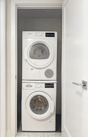 a view of hallway with wooden floor