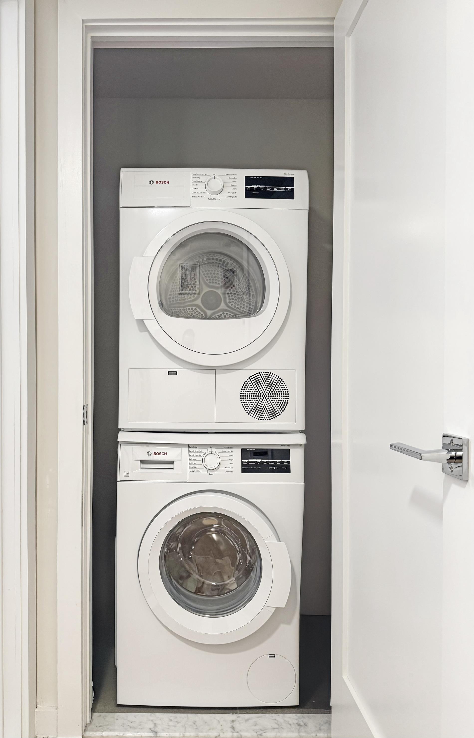 31-22 29th Street, Unit 2B Queens, NY 11106 - Photo 8 of 11 a utility room with dryer and washer