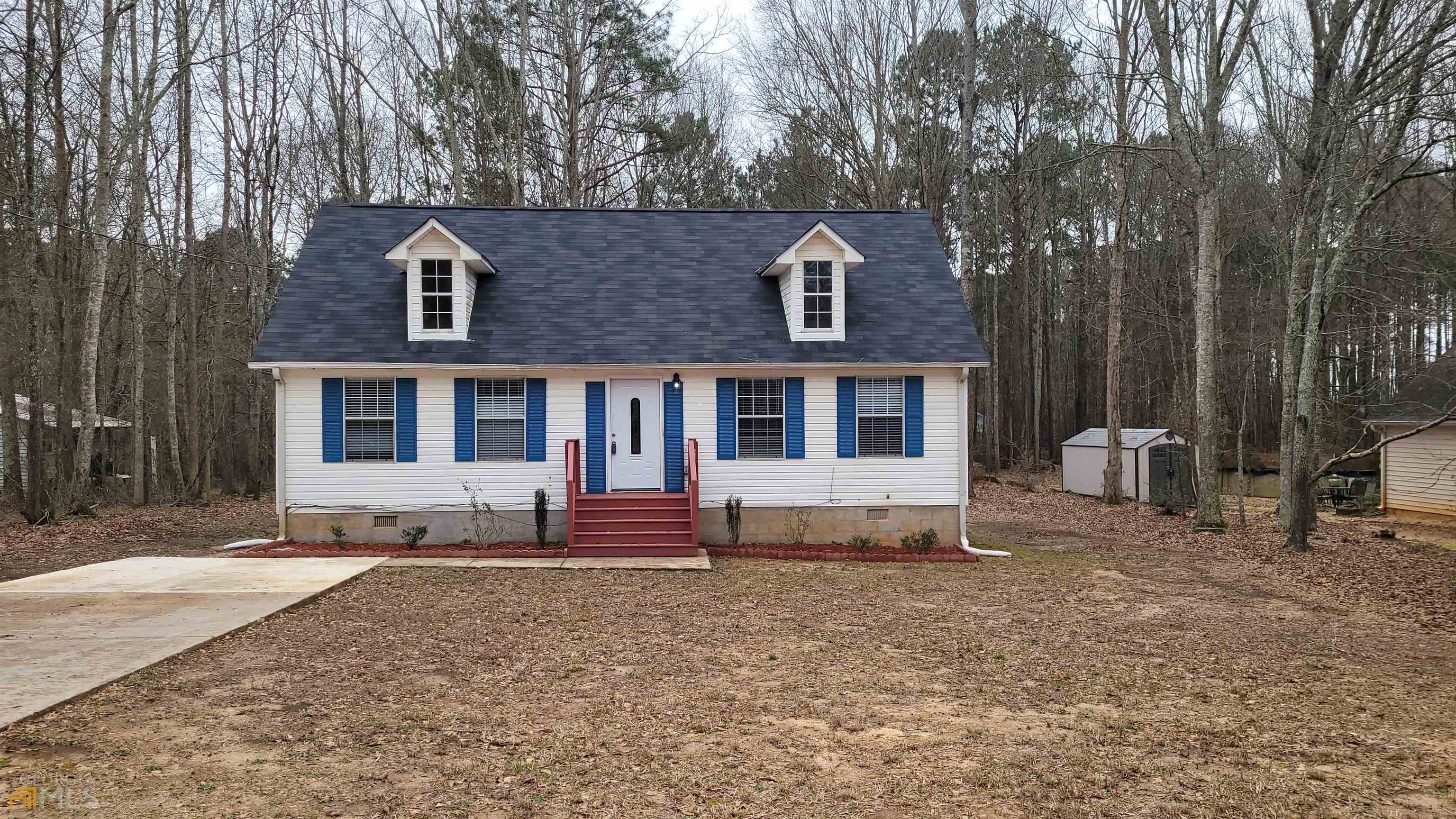 1209 North Hampton Drive Hampton, GA 30228 - Photo 1 of 1 a view of a house with a yard and sitting area