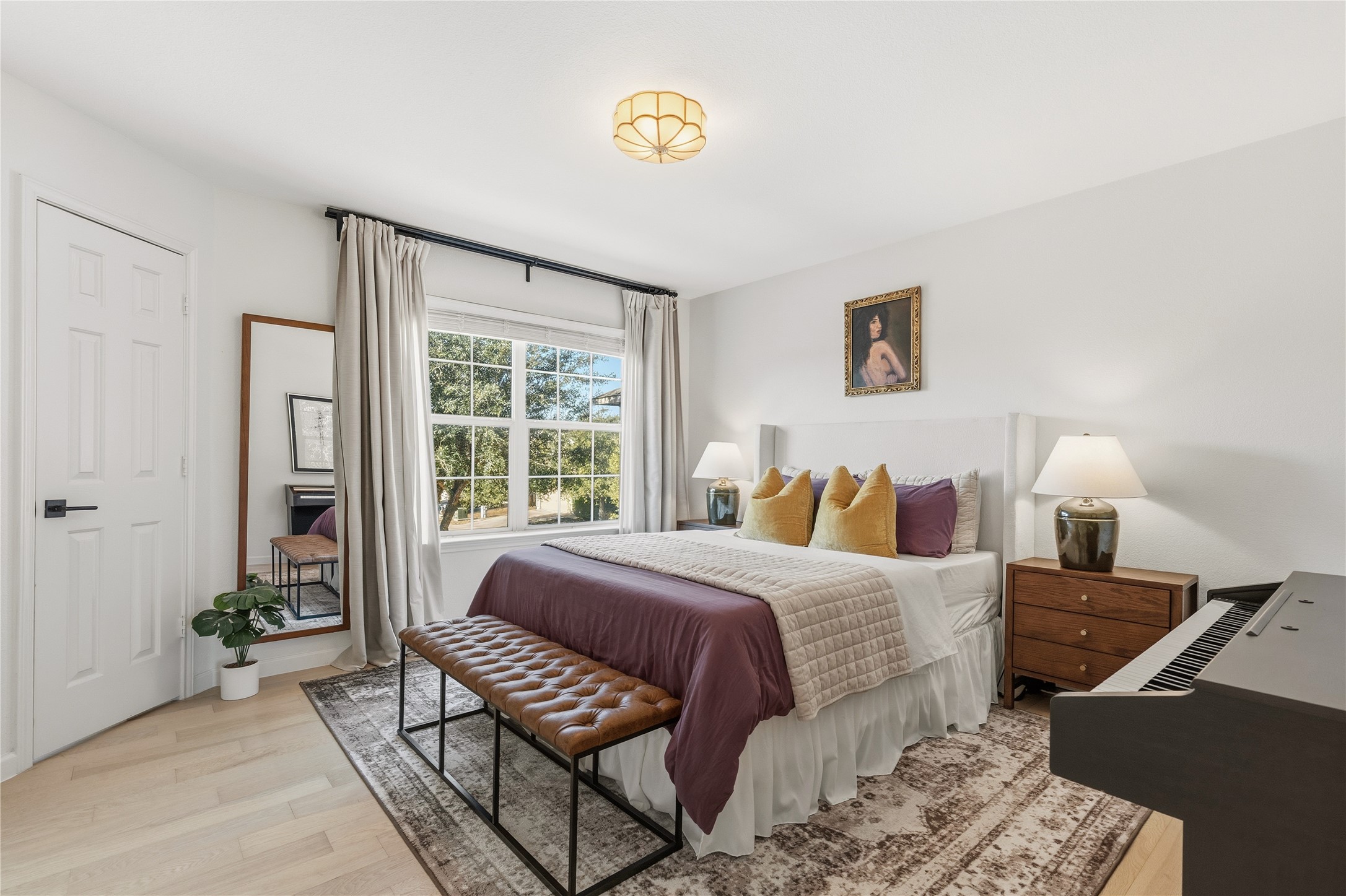 7400 South Glenn Street Austin, TX 78744 - Photo 17 of 36 Bedroom featuring light wood-type flooring