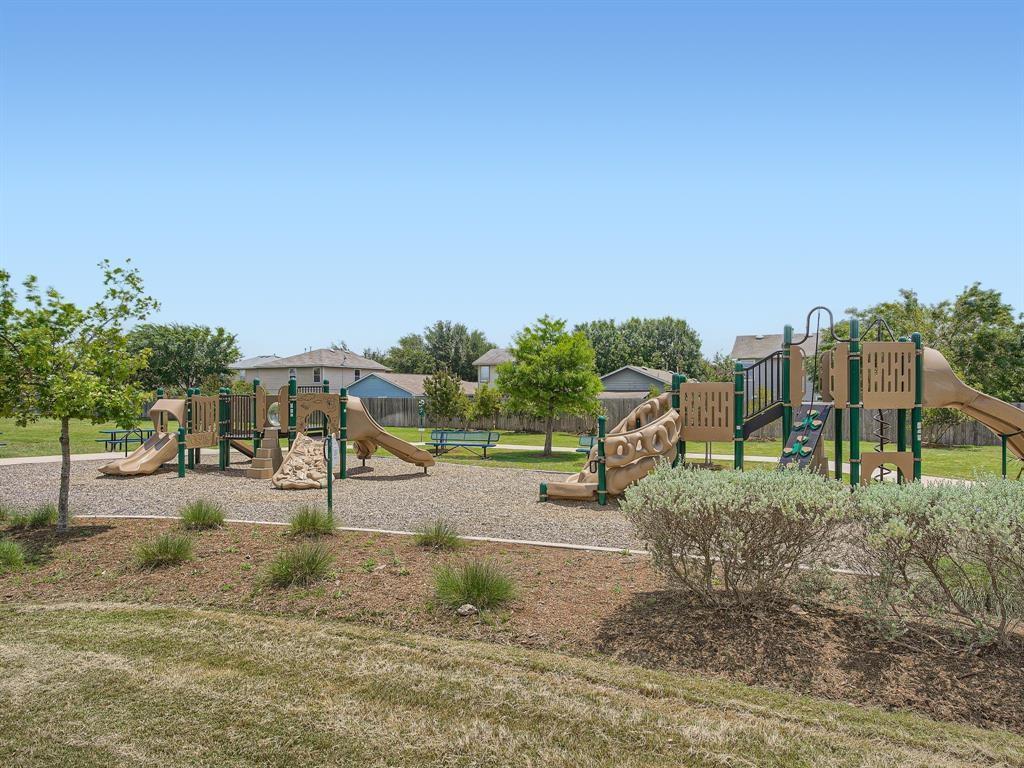 7400 South Glenn Street Austin, TX 78744 - Photo 33 of 36 Community jungle gym with a yard