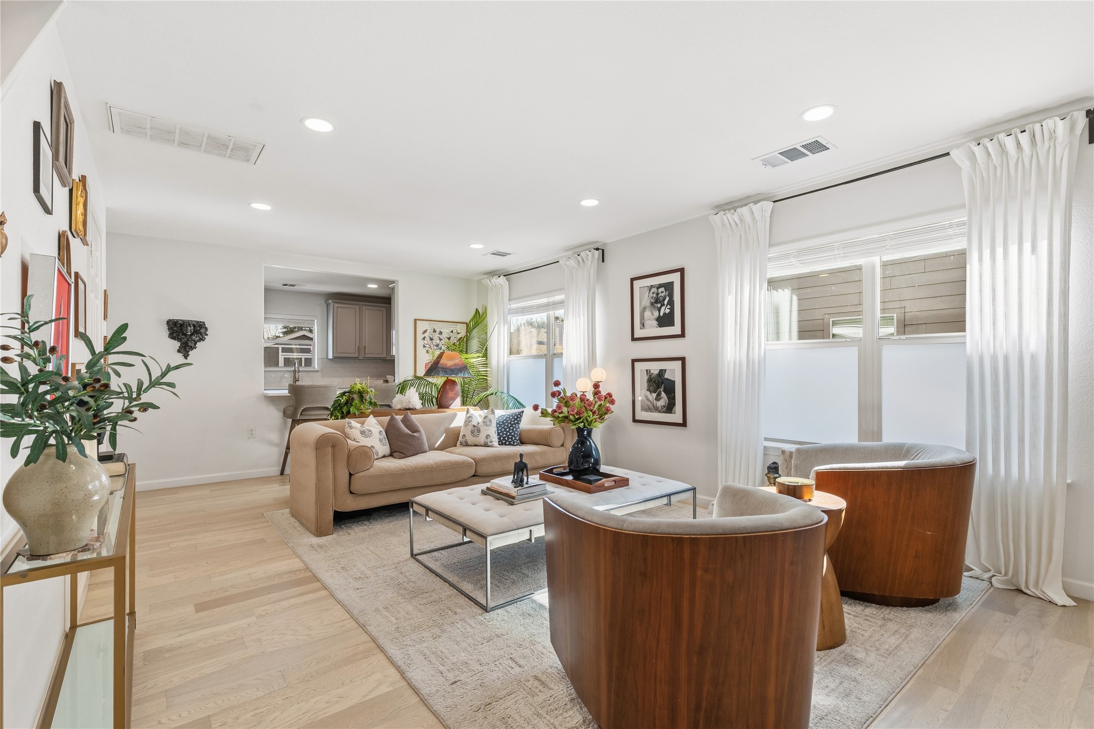 7400 South Glenn Street Austin, TX 78744 - Photo 4 of 36 Living area featuring light wood-style flooring and recessed lighting