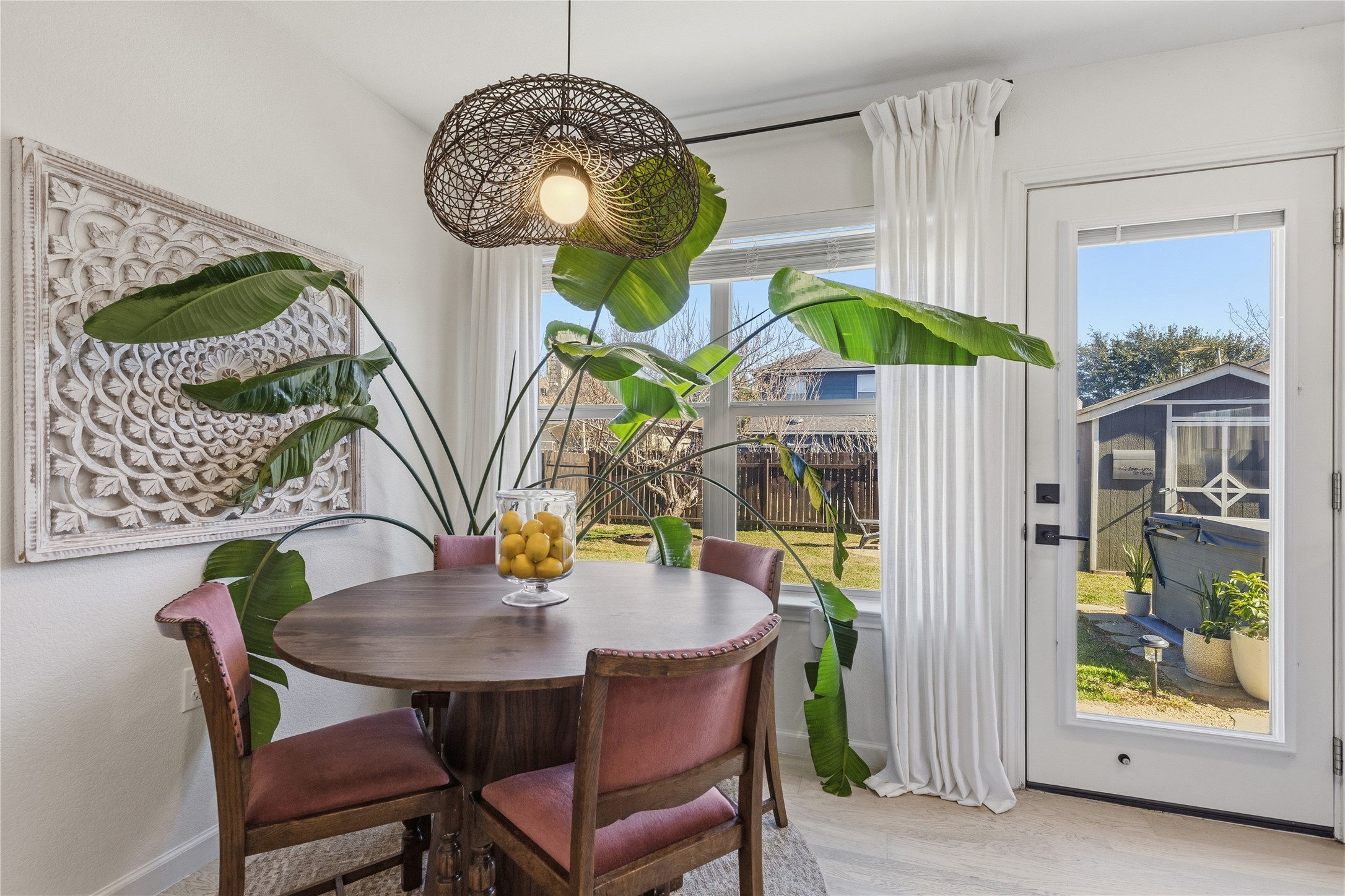 7400 South Glenn Street Austin, TX 78744 - Photo 10 of 36 Dining area with baseboards and wood finished floors