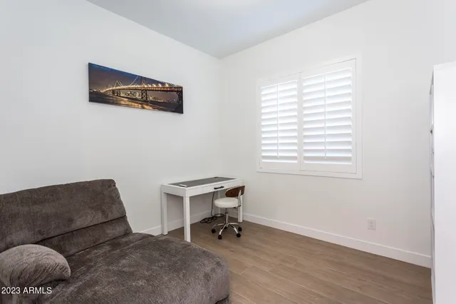 a view of a hallway with wooden shelves