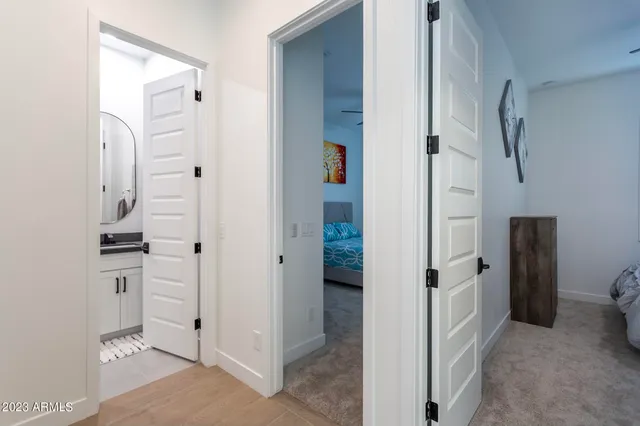 a bathroom with a granite countertop sink a toilet and a mirror