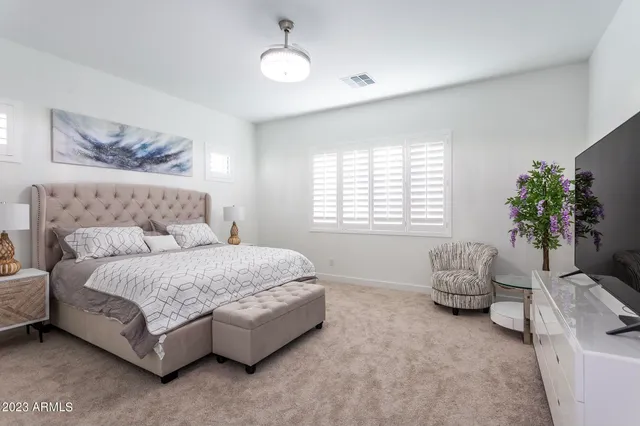 a bathroom with a bathtub a sink a vanity and a shower
