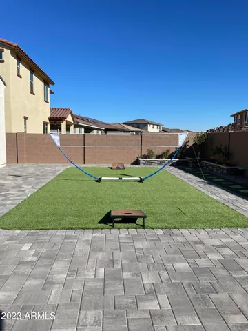 a couple of cars parked in front of a house