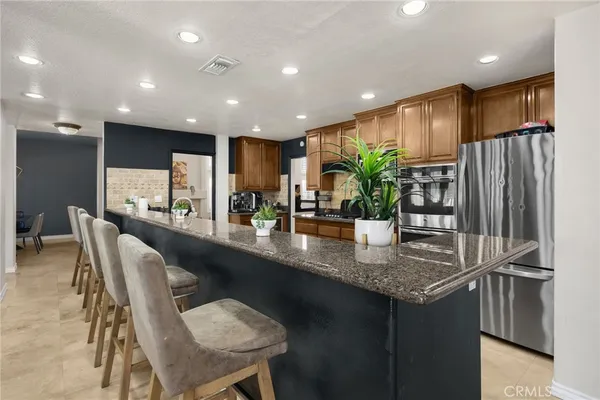 a kitchen with stainless steel appliances and cabinets