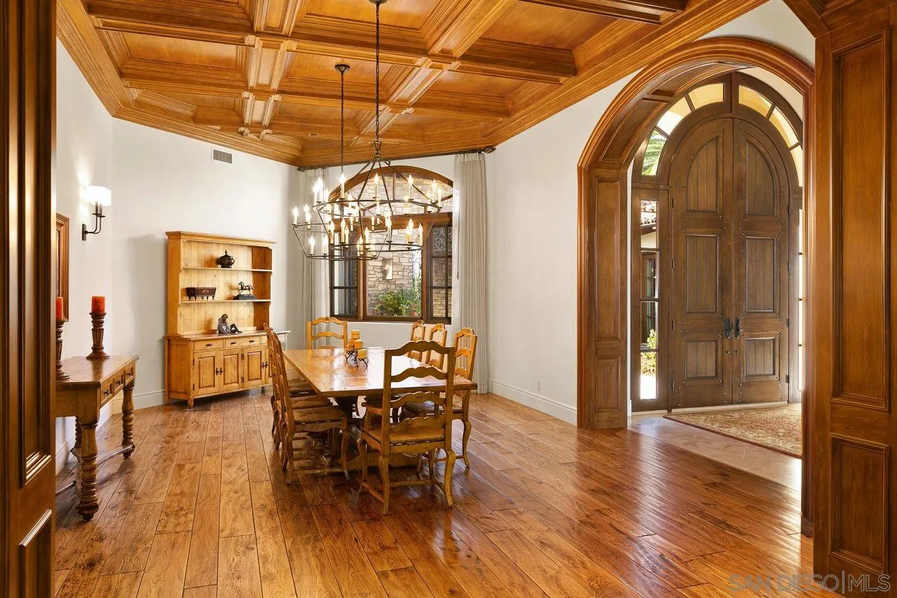 6658 Niemann Ranch Road Rancho Santa Fe, CA 92067 - Photo 11 of 35 a view of a dining room with furniture window and wooden floor