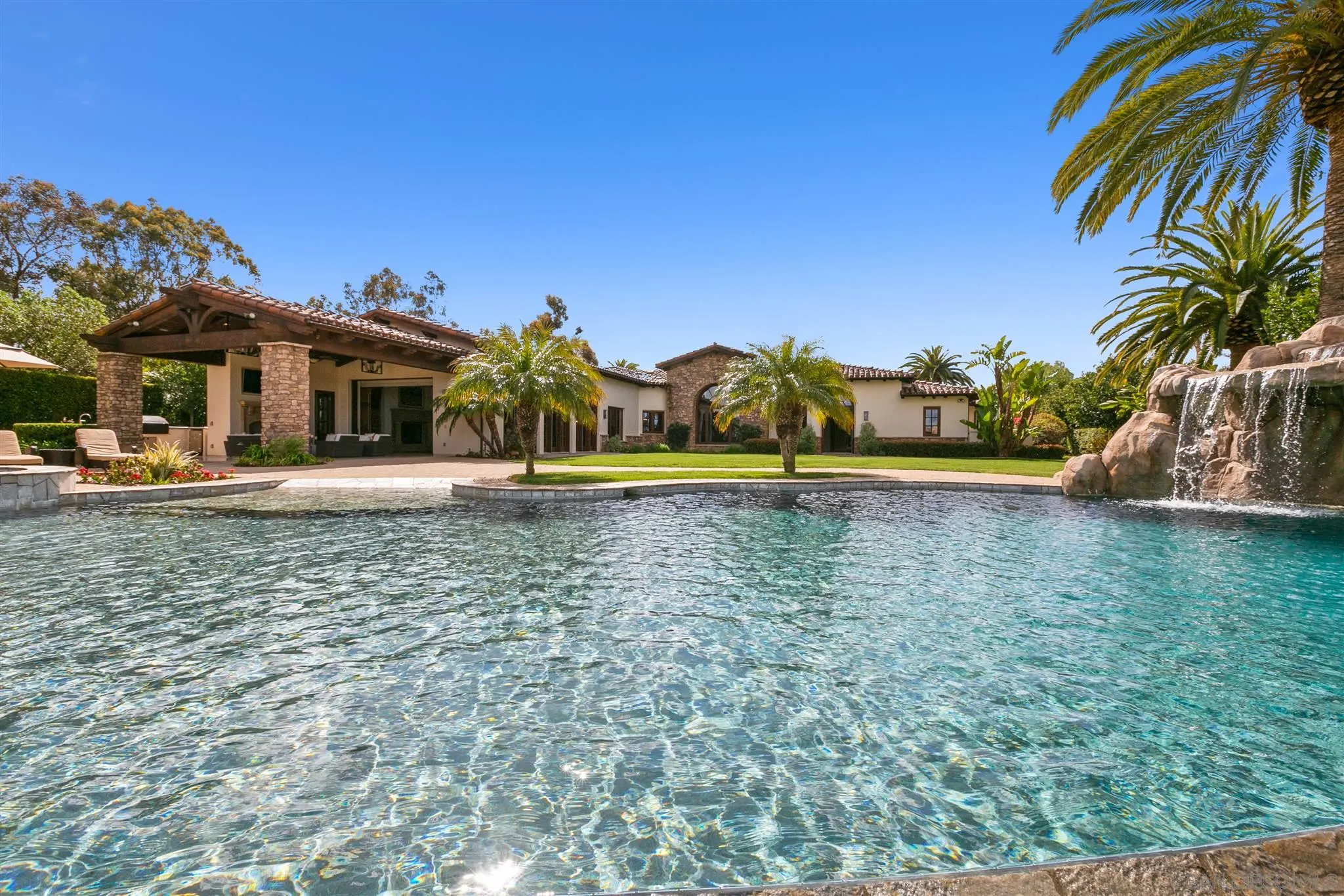 6658 Niemann Ranch Road Rancho Santa Fe, CA 92067 - Photo 2 of 35 a front view of a house with a yard