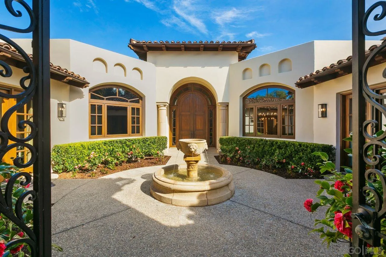 6658 Niemann Ranch Road Rancho Santa Fe, CA 92067 - Photo 8 of 35 a front view of a house with a garden