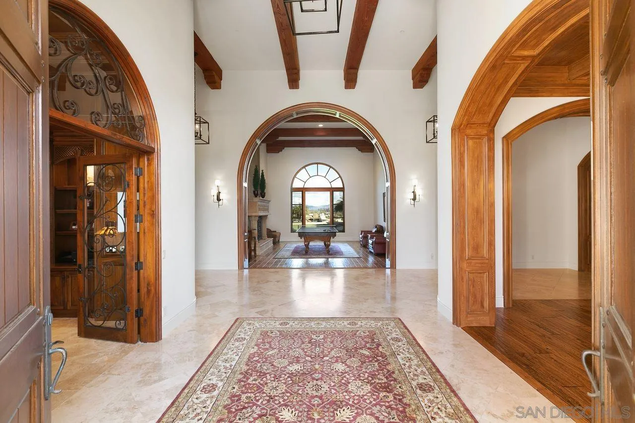 6658 Niemann Ranch Road Rancho Santa Fe, CA 92067 - Photo 9 of 35 a view of a livingroom with wooden floor and furniture