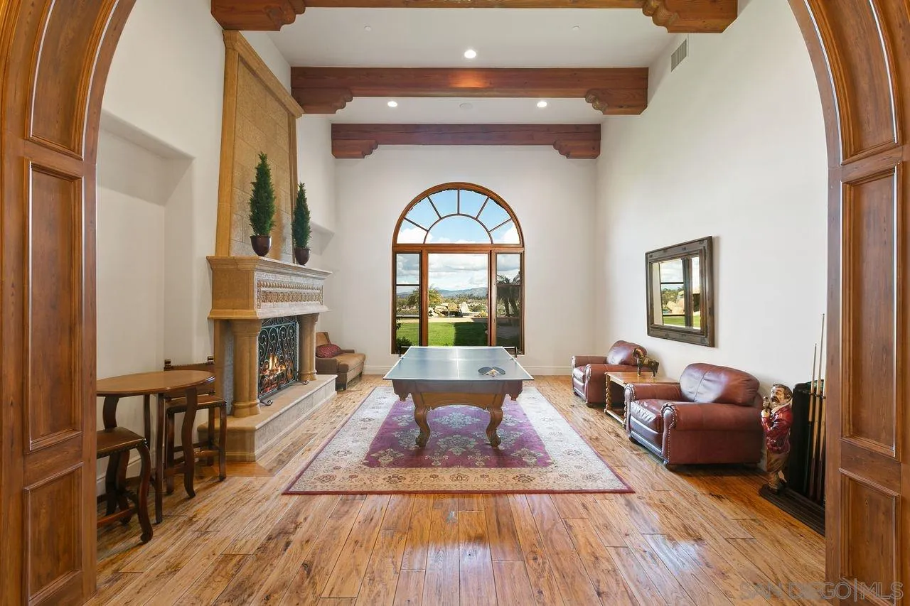 6658 Niemann Ranch Road Rancho Santa Fe, CA 92067 - Photo 10 of 35 a living room with furniture and a large window