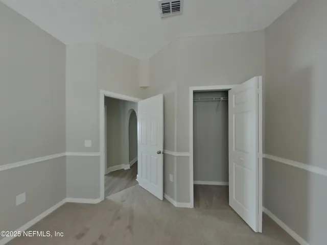 wooden floor and cabinet in an empty room