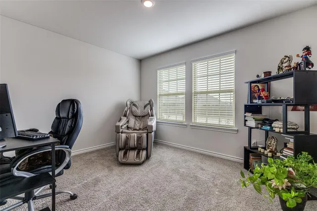 a room with furniture and musical instruments